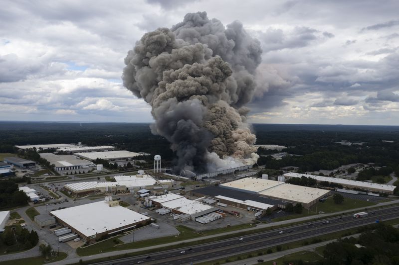 Smoke billows from a fire at the BioLab facility in Conyers on Sunday. Ben Gray for the Atlanta Journal-Constitution