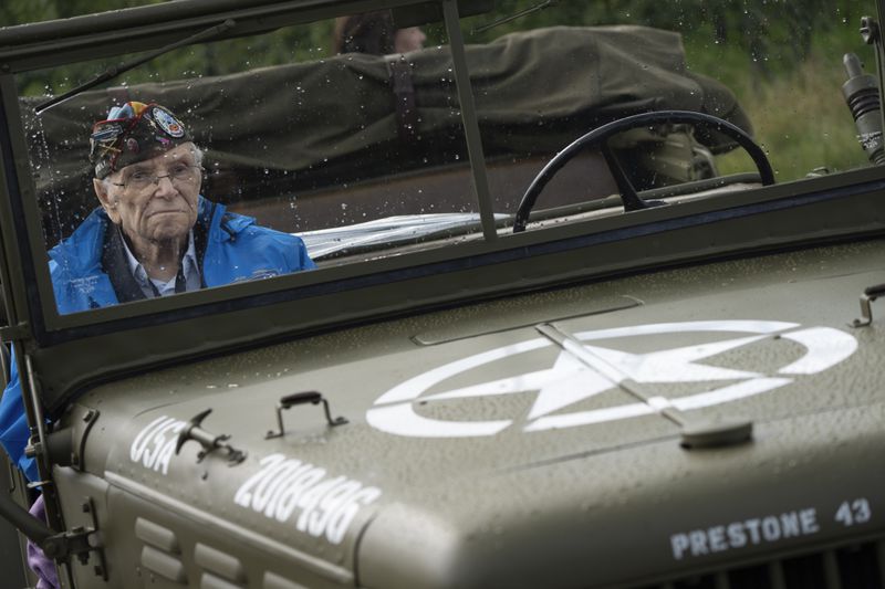 World War II veteran Kenneth Thayer sits in a jeep during a ceremony marking the 80th anniversary of the liberation of the south of the Netherlands in Mesch, Thursday, Sept. 12, 2024. (AP Photo/Peter Dejong, Pool)