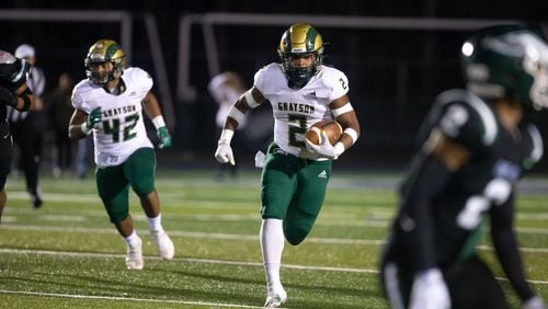 Grayson's Joseph Taylor Jr. (2) runs the ball during a GHSA high school football game between the Collins Hill Eagles and the Grayson Rams at Collins Hill High in Suwanee, GA., on Friday, December 3, 2021. (Photo/ Jenn Finch)