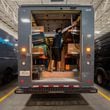An Amazon delivery truck driver moves packages on to the truck at an Amazon delivery station in Duluth on Tuesday, July 16, 2024.  (Ziyu Julian Zhu / AJC)