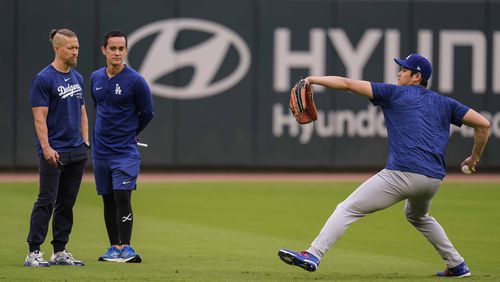 Los Angeles Dodgers' Shohei Ohtani warms up before a baseball game between the Atlanta Braves and the Los Angeles Dodgers, Friday, Sept. 13, 2024, in Atlanta. (AP Photo/Mike Stewart)