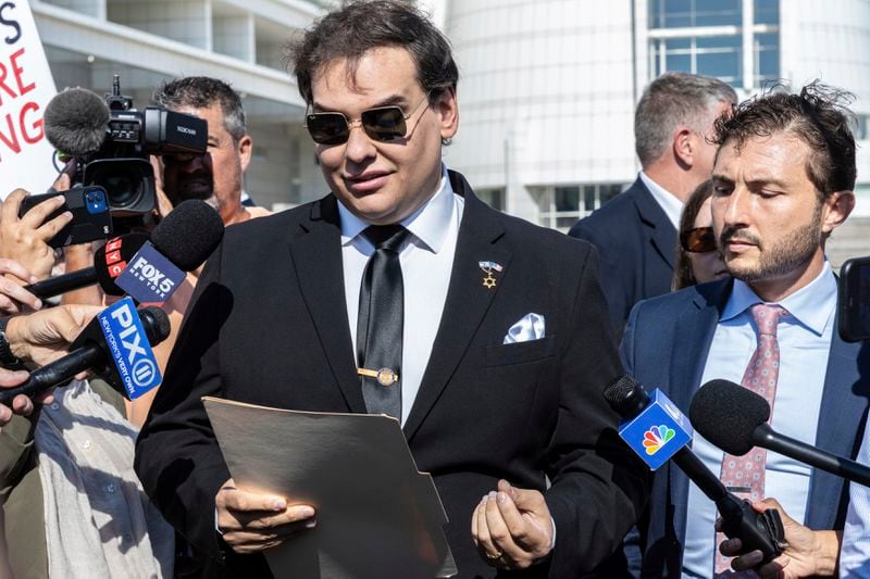 Former U.S. Rep George Santos speaks to the media outside the federal courthouse in Central Islip, N.Y. on, Monday, Aug. 19, 2024 in New York. (AP Photo/Stefan Jeremiah)