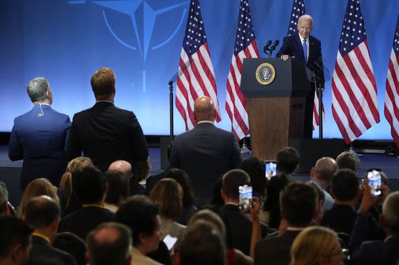 As reporters continue to ask questions, President Joe Biden walks from the podium after a news conference Thursday July 11, 2024, on the final day of the NATO summit in Washington. (AP Photo/Jacquelyn Martin)