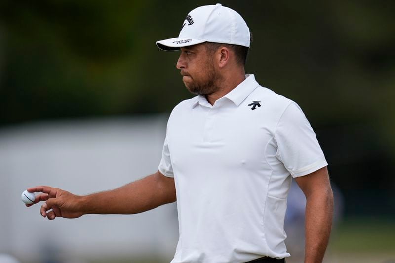 Xander Schauffele walks on the seventh green during the second round of the Tour Championship golf tournament, Friday, Aug. 30, 2024, in Atlanta. (AP Photo/Mike Stewart)