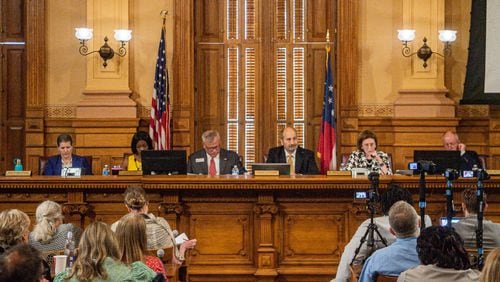 The State Election Board decided Tuesday to reconsider at its Aug. 6 meeting proposed rules that would allow more poll watcher access to ballot counting and require counties to post daily ballot tallies on their websites during early voting. (Ziyu Julian Zhu / AJC)