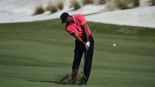 Tiger Woods hits from the first fairway during the final round of the Hero World Challenge golf tournament at Albany Golf Club in Nassau, Bahamas, Sunday, Dec. 3, 2017. (AP Photo/Dante Carrer)