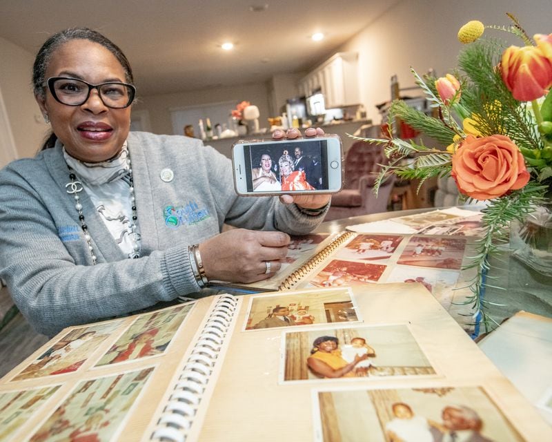 Linda Becquer-Pritchett remembers her aunt, Latin music legend Celia Cruz, sharing a photo of Cruz with Aretha Franklin at her home. The South Fulton councilwoman grew up with in Brooklyn sharing a home with the “Queen of Salsa” and was often cared for by her aunt while her mother was busy with Linda's twin siblings.  (Jenni Girtman for The Atlanta Journal-Constitution)