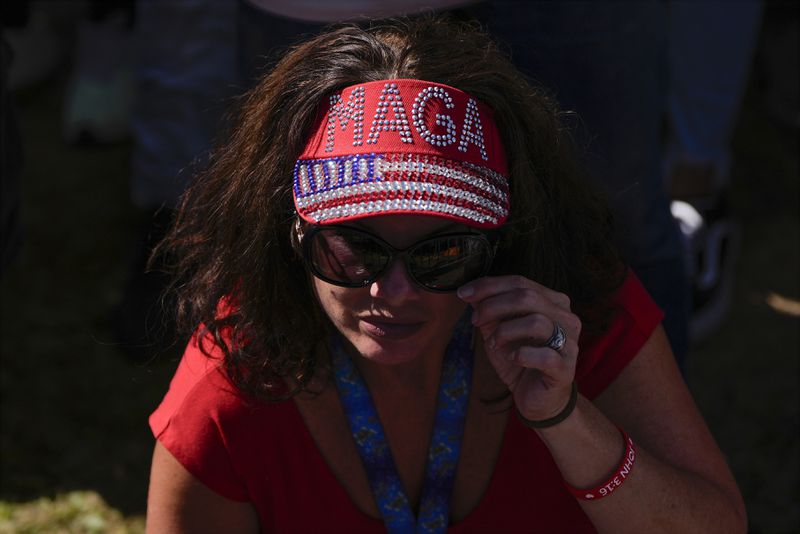 A supporter arrives before Republican presidential nominee former President Donald Trump speaks at a campaign rally at the Butler Farm Show, Saturday, Oct. 5, 2024, in Butler, Pa. (AP Photo/Julia Demaree Nikhinson)