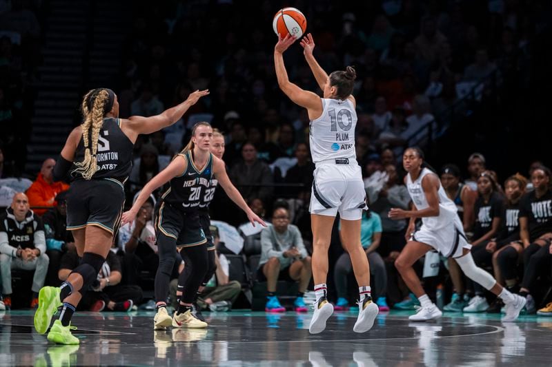 Las Vegas Aces guard Kelsey Plum (10) shoots a 3 point basket during the first half of a WNBA basketball second-round playoff game against the New York Liberty, Sunday, Sept. 29, 2024, in New York. (AP Photo/Corey Sipkin)