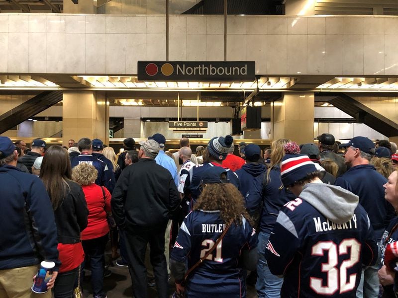 At times hundreds of passengers lined the northbound platform at Five Points station after Sunday’s Super Bowl. But MARTA kept the trains moving, and the crowds thinned out quickly. (David Wickert/AJC)