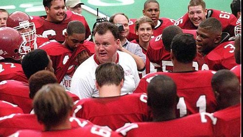 Robert Davis (center) won 354 games and three state titles as a Georgia high school football coach.