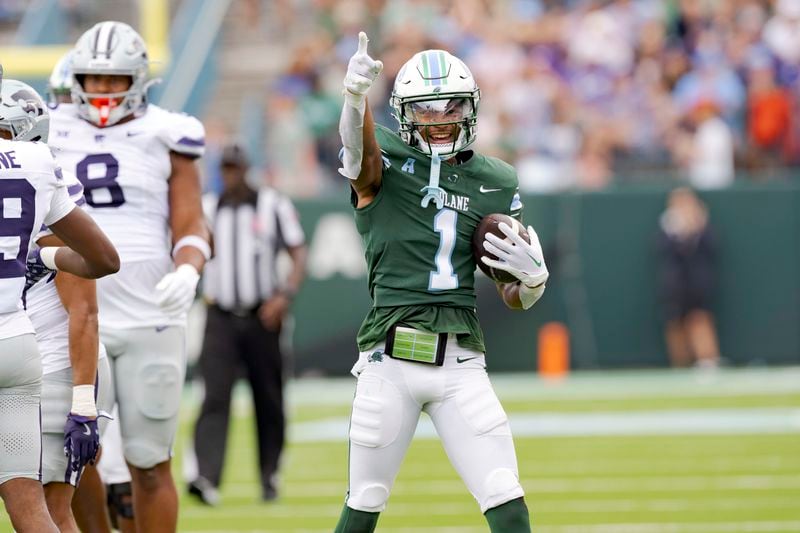 Tulane wide receiver Dontae Fleming (1) signals a first down after a reception during the first half of an NCAA college football game against Kansas State in New Orleans, Saturday, Sept. 7, 2024. (AP Photo/Matthew Hinton)