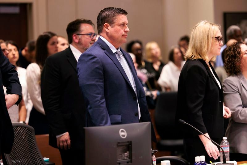 FILE - Auburn Police Officer Jeffrey Nelson, center, attends closing arguments in his trial, Thursday, June 20, 2024, at the Maleng Regional Justice Center in Kent, Wash. A jury found the suburban Seattle police officer guilty of murder Thursday, June 27, in the 2019 shooting death of a homeless man outside a convenience store, marking the first conviction under a Washington state law easing prosecution of law enforcement officers for on-duty killings. (Erika Schultz/The Seattle Times via AP, File)