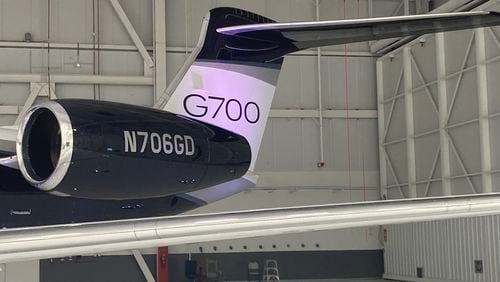 A flight test model of the Gulfstream G700 sits in a maintenance hangar at the Gulfstream Savannah Service Center East. (Adam Van Brimmer/AJC)