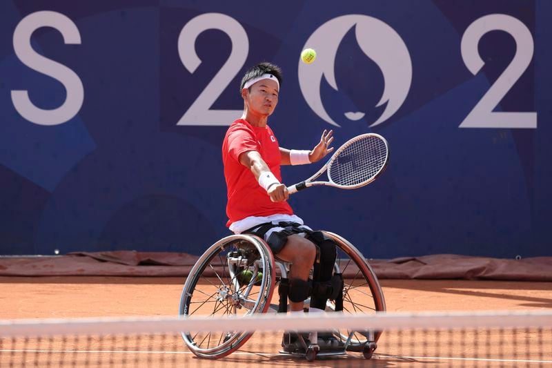 Japan's Takuya Miki competes in the Men's Singles, 3rd round of wheelchair tennis at Roland- Garros Stadium, during the 2024 Paralympics, Monday, Sept. 2, 2024 in Paris, France. (AP Photo/Leighton Smithwick)