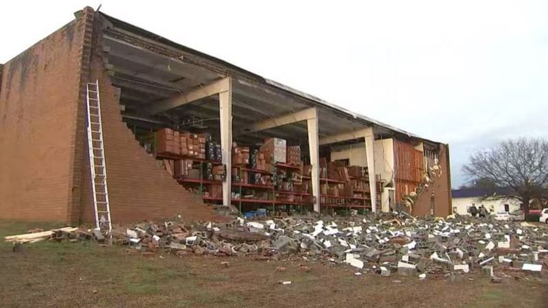 A wall was pulled down on one side of an auto parts warehouse in Austell, Cobb County officials said.