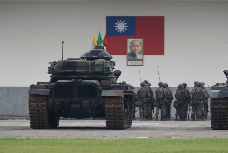 Soldiers are assembled in front of the Taiwan national flag in Taoyuan, Northern Taiwan, Thursday, May 23, 2024. Taiwan President Lai Ching-te inspected Taiwanese military on Thursday. (AP Photo/Chiang Ying-ying)