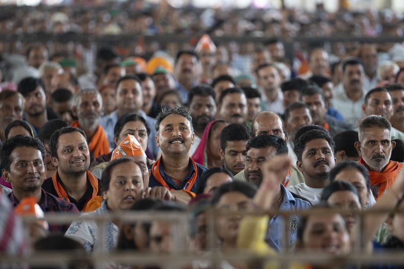 FILE- Bharatiya Janata Party (BJP) supporters listen as their Indian Prime Minister Narendra Modi speaks during a campaign rally of Jammu and Kashmir Assembly elections in Jammu, India, Saturday, Sept. 28, 2024. (AP Photo/Channi Anand, File)