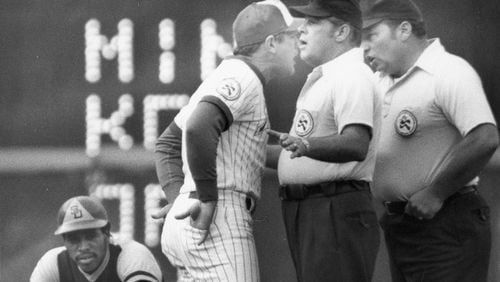 Braves manager Dave Bristol argues with umpires as the Padres’ Dave Winfield waits for a resolution. AJC file photo