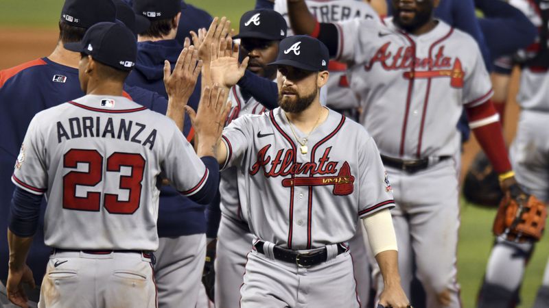 Braves center fielder Ender Inciarte (center) celebrates a 6-4 win over the Miami Marlines with teammates Sunday, June 13, 2021, in Miami. Inciarte hit a home run in the game. (Jim Rassol/AP)