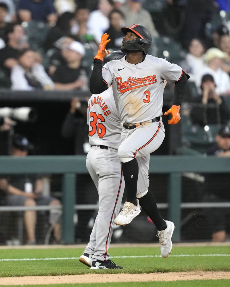 Baltimore Orioles' Jorge Mateo celebrates his three-run home run off Chicago White Sox starting pitcher Mike Clevinger as he passes third base coach Tony Mansolino during the fourth inning of a baseball game Thursday, May 23, 2024, in Chicago. (AP Photo/Charles Rex Arbogast)