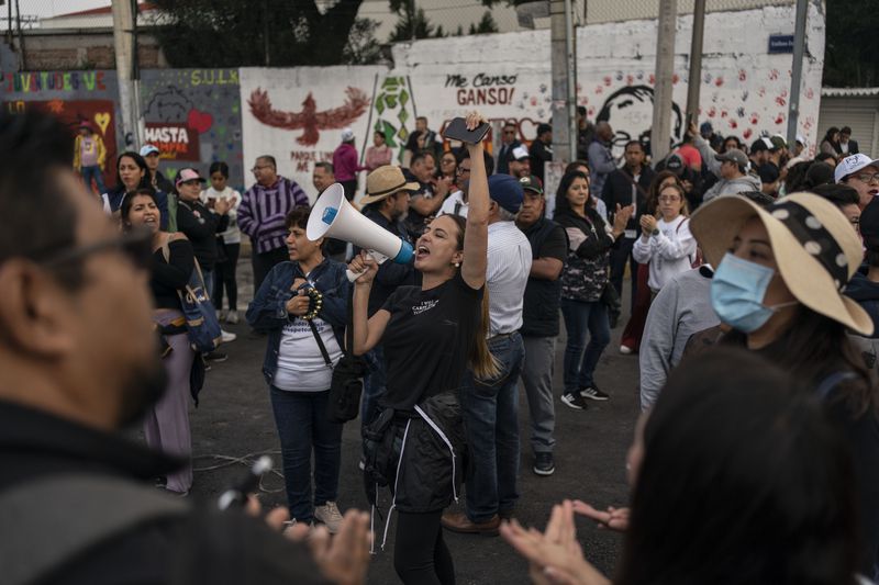 Protesters block entrances to Congress over constitutional reform proposals that would make judges stand for election in Mexico City, Tuesday, Sept. 3, 2024. (AP Photo/Felix Marquez)