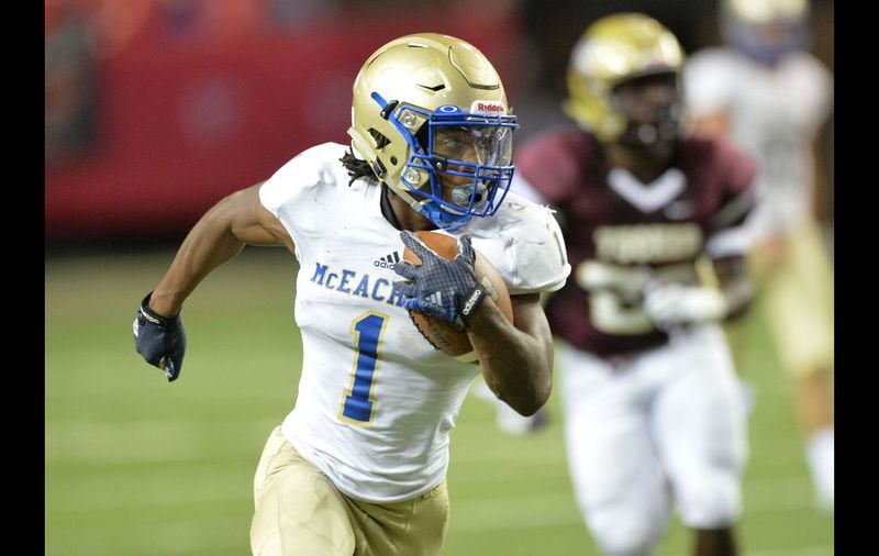August 22, 2015 Atlanta - McEachern Sam Jackson (1) runs for a touchdown against the Tucker in the first half of their game in the Corky Kell Classic at the Georgia Dome on Saturday, August 22, 2015. HYOSUB SHIN / HSHIN@AJC.COM