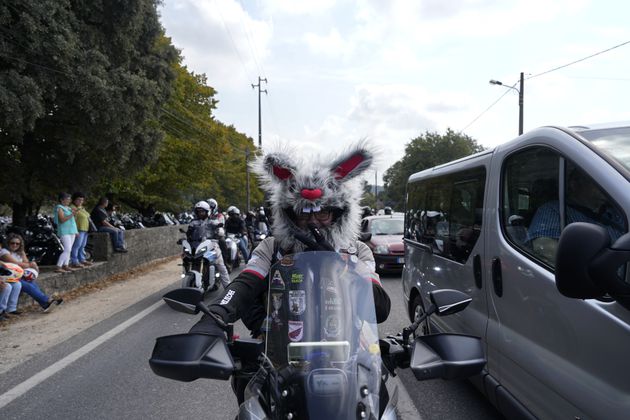 A motorcyclist wearing a furry helmet leaves after attending the IX Pilgrimage of the Blessing of Helmets at the Roman Catholic holy shrine of Fatima, in Fatima, Portugal, Sunday, Sept. 22, 2024. (AP Photo/Ana Brigida)