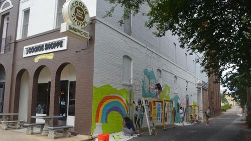 Students from the Albany Museum of Art's Teen Board were hard at work this week, painting a mural on the north exterior wall of The Cookie Shoppe in downtown Albany, Georgia. (Photo Courtesy of Lucille Lannigan)