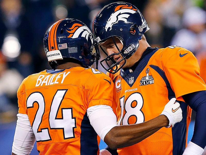 Denver Broncos' Champ Bailey, left, speaks with quarterback Peyton Manning before the NFL Super Bowl XLVIII football game against the Seattle Seahawks on Sunday, Feb. 2, 2014, in East Rutherford, N.J. (AP Photo/Paul Sancya)