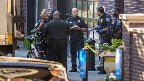 Emory University police are seen outside Emory Point off Clifton Road on Thursday morning after an emergency alert was issued about a shooting near campus.