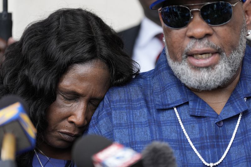 FILE - RowVaughn Wells rests on her husband's shoulder Rodney Wells, the parents of Tyre Nichols, during a news conference after a former Memphis Police Department officer pleaded guilty to civil rights violations in the 2023 fatal beating of their son, Aug. 23, 2024, in Memphis, Tenn. (AP Photo/George Walker IV, File)