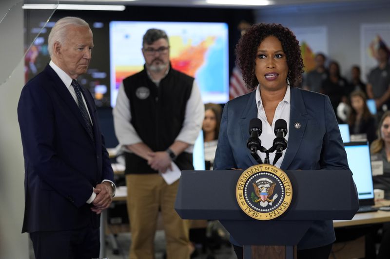 President Joe Biden listens to District of Columbia Mayor Muriel Bowser during a visit to the D.C. Emergency Operations Center, Tuesday, July 2, 2024, in Washington. (AP Photo/Evan Vucci)