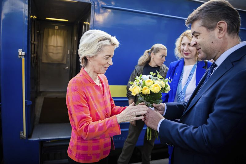 President of the European Commission, Ursula von der Leyen, left, is greeted as she arrives at the railway station in Kyiv, Ukraine, Friday, Sept. 20, 2024. (Christoph Soeder, Pool via AP)