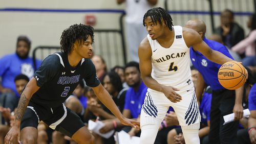 Wheeler guard Isaiah Collier (4) controls the ball against Newton guard Stephon Castle (2) during the teams' matchup in February. Collier was named first team Naismith All-America and Castle was named to the second team in an announcement by the Atlanta Tipoff Club March 1.