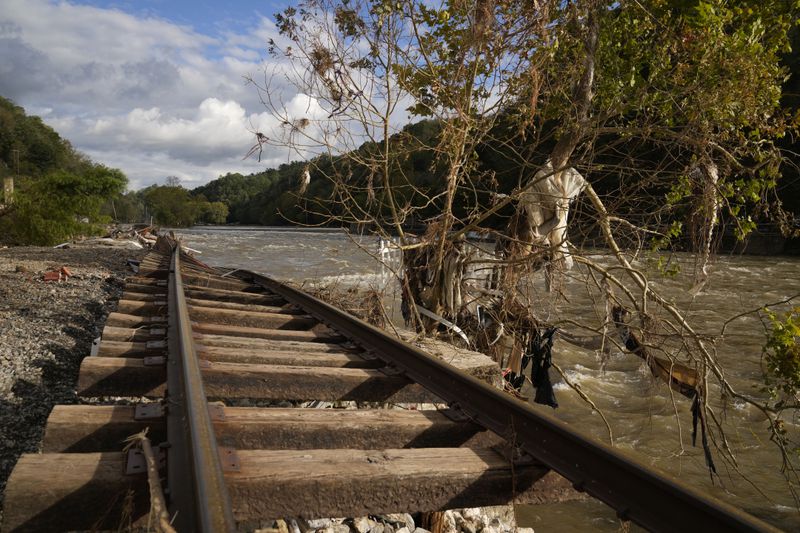 Train tracks washed out during Hurricane Helene run along the French Broad River, Tuesday, Oct. 1, 2024, in Marshall, N.C. (AP Photo/Jeff Roberson)