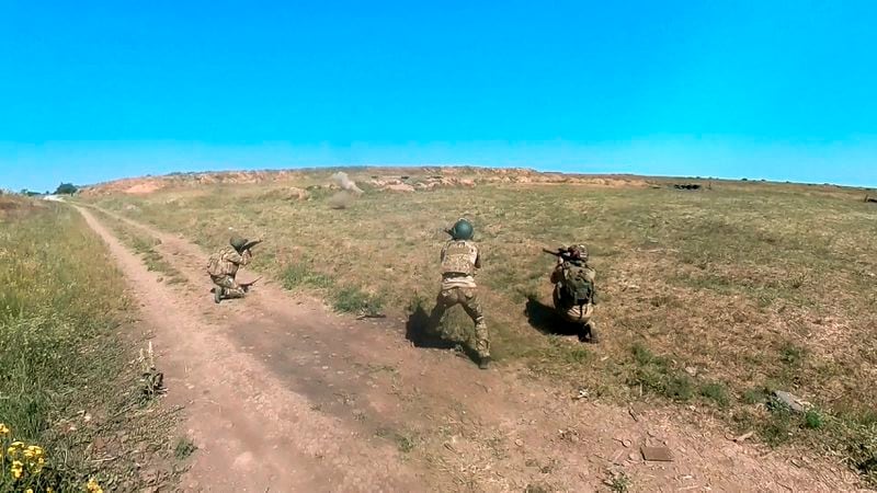 In this photo, taken from video released by the Russian Defense Ministry Press Service on Monday, July 1, 2024, Russian soldiers shoot toward an Ukrainian positions in an undisclosed location in Ukraine. (Russian Defense Ministry Press Service via AP, File)