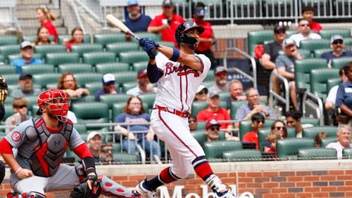 Atlanta Braves outfielder Eddie Rosario (8) watches the ball after hitting a two-run home run during the seventh inning against the St. Louis Cardinals at Truist Park on Saturday, July 20, 2024, in Atlanta.
(Miguel Martinez/ AJC)