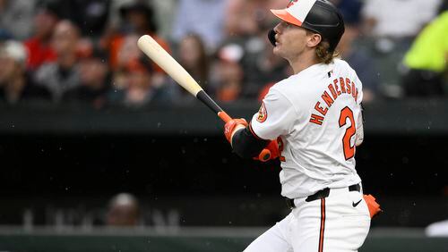 Baltimore Orioles' Gunnar Henderson watches his grand slam against the Boston Red Sox during the second inning of a baseball game Wednesday, May 29, 2024, in Baltimore. (AP Photo/Nick Wass)