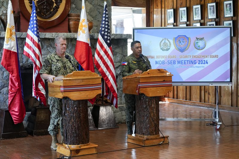 U.S. Indo-Pacific Command Commander Admiral Samuel Paparo, left, and Philippines military chief Gen. Romeo Brawner Jr.,answer questions during a press conference on the Mutual Defense Board-Security Engagement Board held at the Philippine Military Academy in Baguio, northern Philippines on Thursday, Aug. 29, 2024. (AP Photo/Aaron Favila)