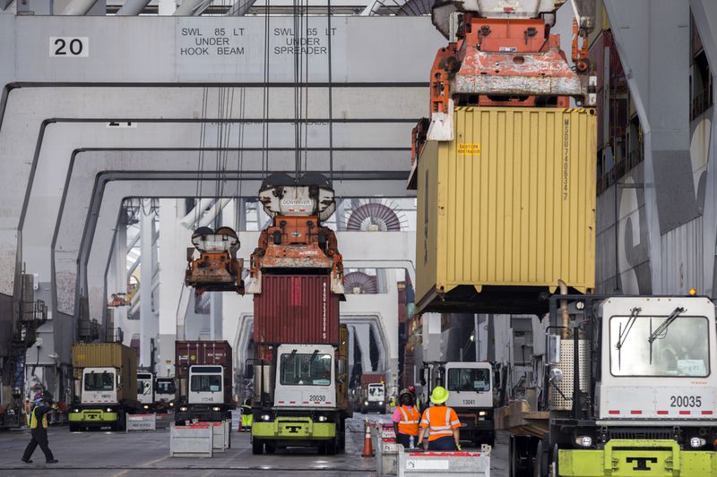 Longshoremen load and unload containers at the Georgia Ports Authority Garden City Terminal. (AJC Photo/Stephen B. Morton)

