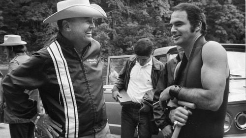 Poet, novelist and screenwriter James Dickey chats with star Burt Reynolds on the set of 1972’s “Deliverance.”