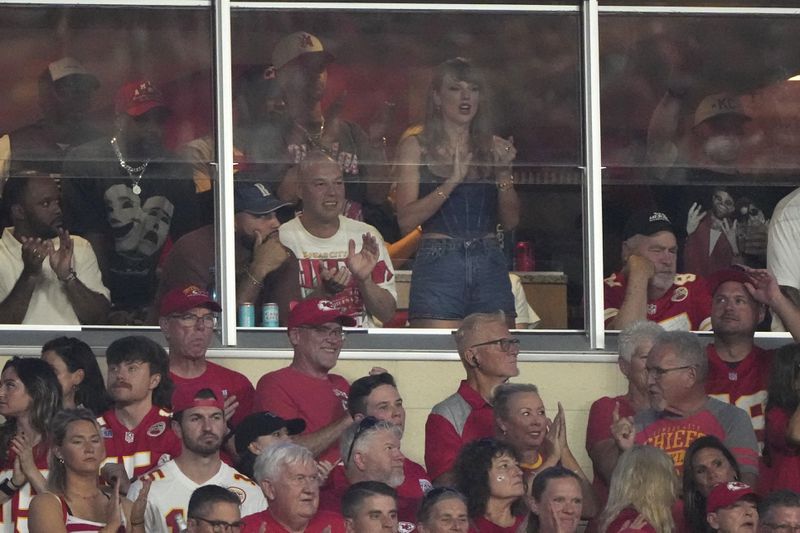 Taylor Swift is seen in a suite during the first half of an NFL football game between the Kansas City Chiefs and the Baltimore Ravens Thursday, Sept. 5, 2024, in Kansas City, Mo. (AP Photo/Charlie Riedel)