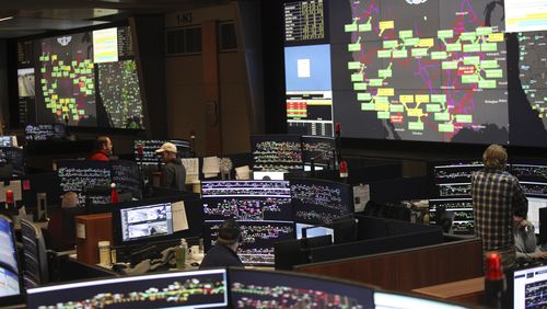 FILE - Union Pacific dispatchers keep track of trains moving across the western United States at the Harriman Dispatch Center in Omaha, Neb., Dec. 15, 2023. (AP Photo/Josh Funk, File)