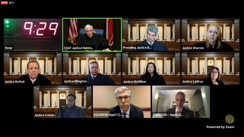 The Georgia Supreme Court on Wednesday heard arguments via Zoom as to whether property owners can boot unauthorized cars on their parking lots. Top row from left: Chief Justice David Nahmias and Justices Michael Boggs and Sarah Hawkins Warren. Middle row from left: Justices Charles Bethel, John Ellington, Carla Wong McMillian and Shawn Ellen LaGrua. Bottom row from left: Justice Verda Colvin and lawyers David Conley and Frank Lowery. (Pete Corson/peter.corson@ajc.com)