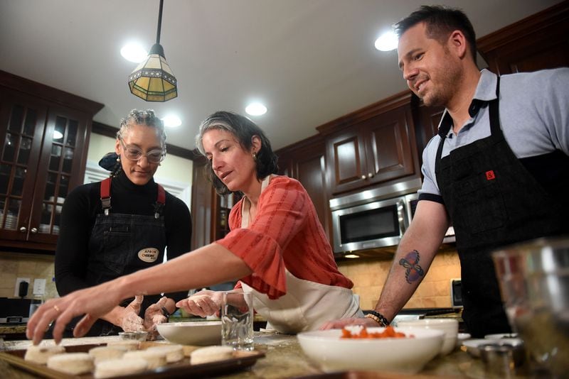 February 22, 2019 Atlanta - The AJCâs Ligaya Figueras (center) hosts food expert Chadwick Boyd (right) and Top Chef Carla (left) Hall at her home, where the two share tips with Ligaya on how to make the best biscuits. RYON HORNE / RHORNE@AJC.COM