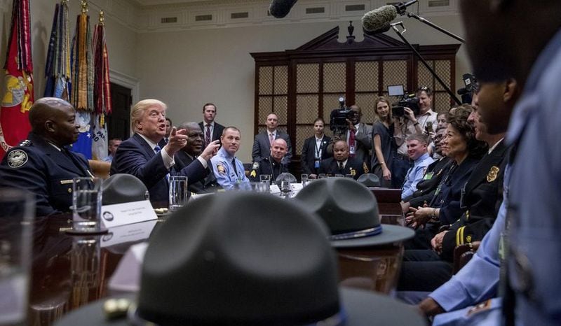 Brian Jack, standing to President Donald Trump's left at a meeting with Georgia first responders, is a potential candidate in 2024 in the state's 3rd Congressional District. AP file.