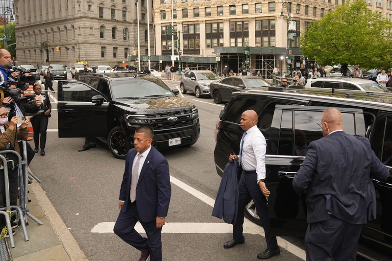 New York City Mayor Eric Adams, second from right, arrives to court in New York, Wednesday, Oct. 2, 2024. (AP Photo/Seth Wenig)