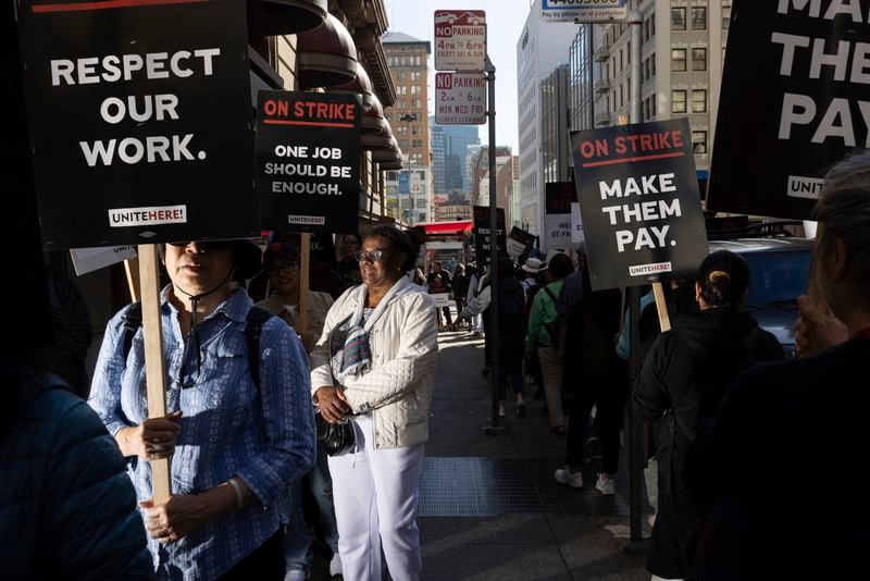 Hotel workers picket outside the Westin St. Francis Monday, Sept. 2, 2024, in San Francisco. (AP Photo/Benjamin Fanjoy)