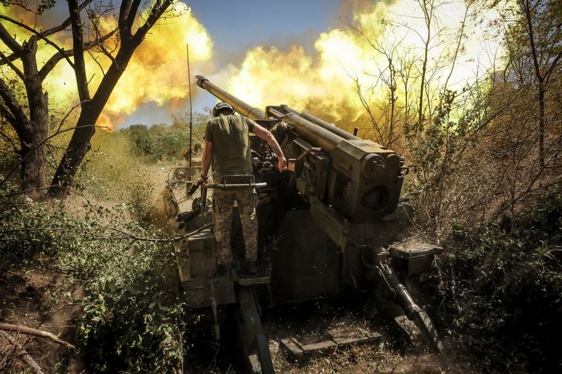 In this photo provided by Ukraine's 24th Mechanised Brigade press service, servicemen of the 24th Mechanised Brigade fire a" Giatsint-S" 152mm self-propelled howitzer towards Russian positions near Chasiv Yar town, in Donetsk region, Ukraine, Tuesday, Aug. 20, 2024. (Oleg Petrasiuk/Ukrainian 24th Mechanised Brigade via AP)